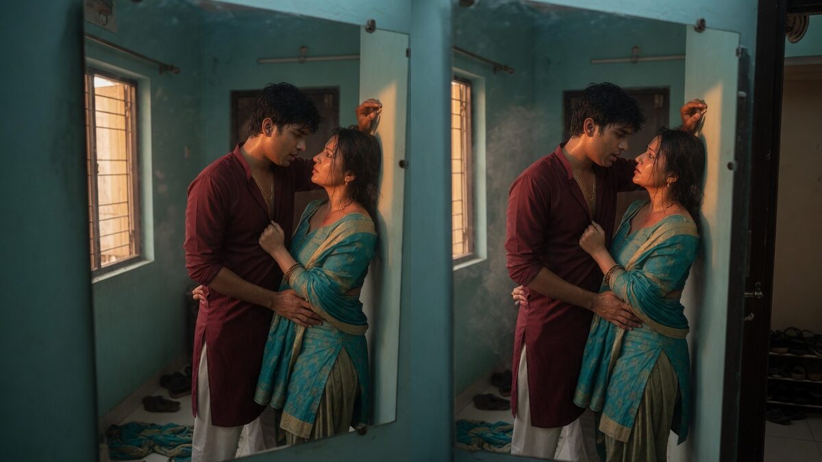 Two fully clothed adults, one adult Indian man and one adult Indian woman in an Indian apartment entry.