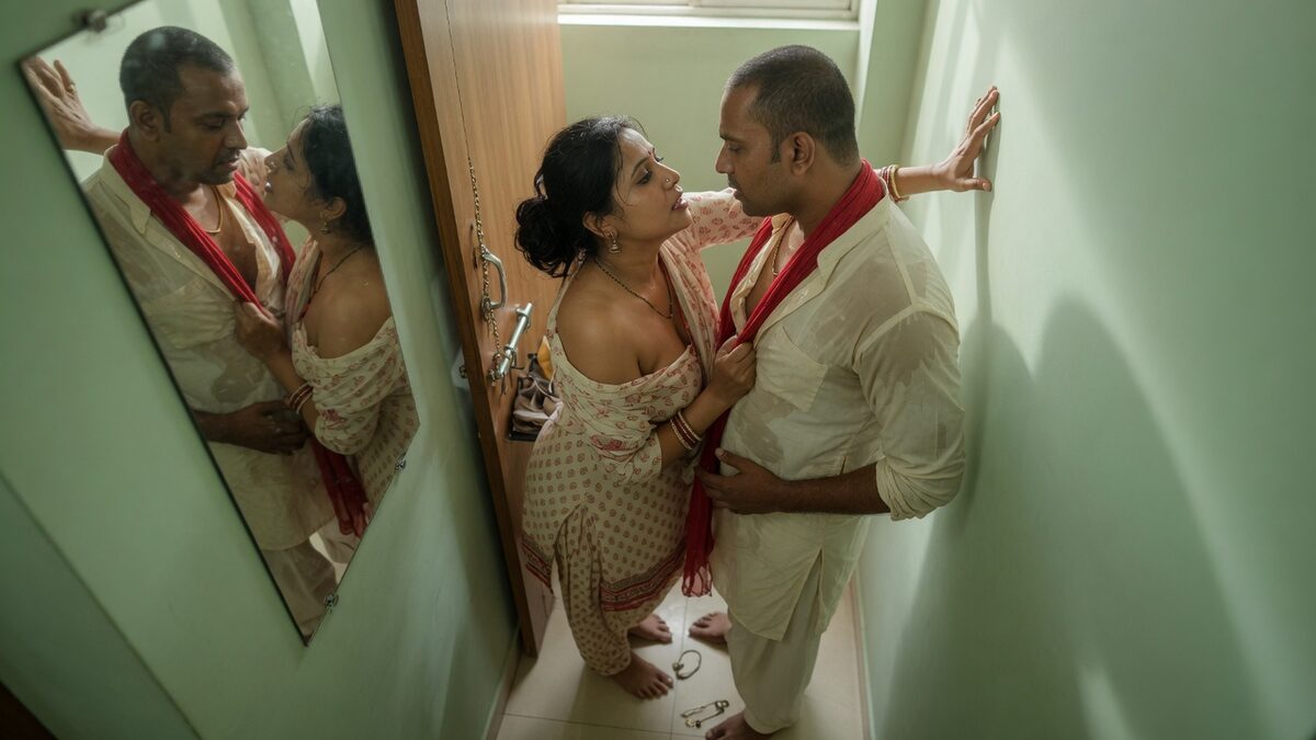 Two fully clothed adults, one adult Indian man and one adult Indian woman in a contemporary Indian city apartment entry.