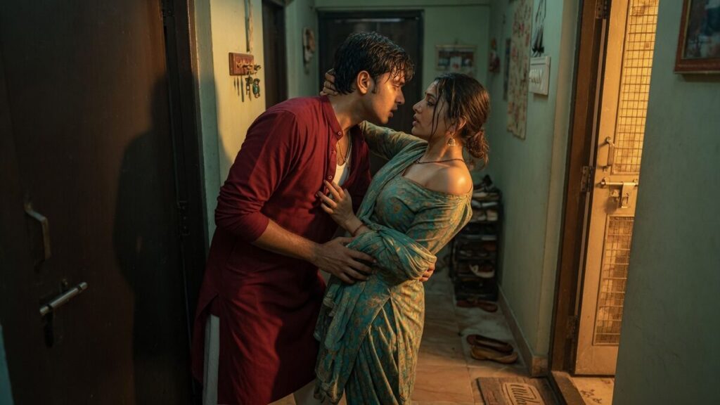 Two fully clothed adults, one adult Indian man and one adult Indian woman in an Indian apartment entry.