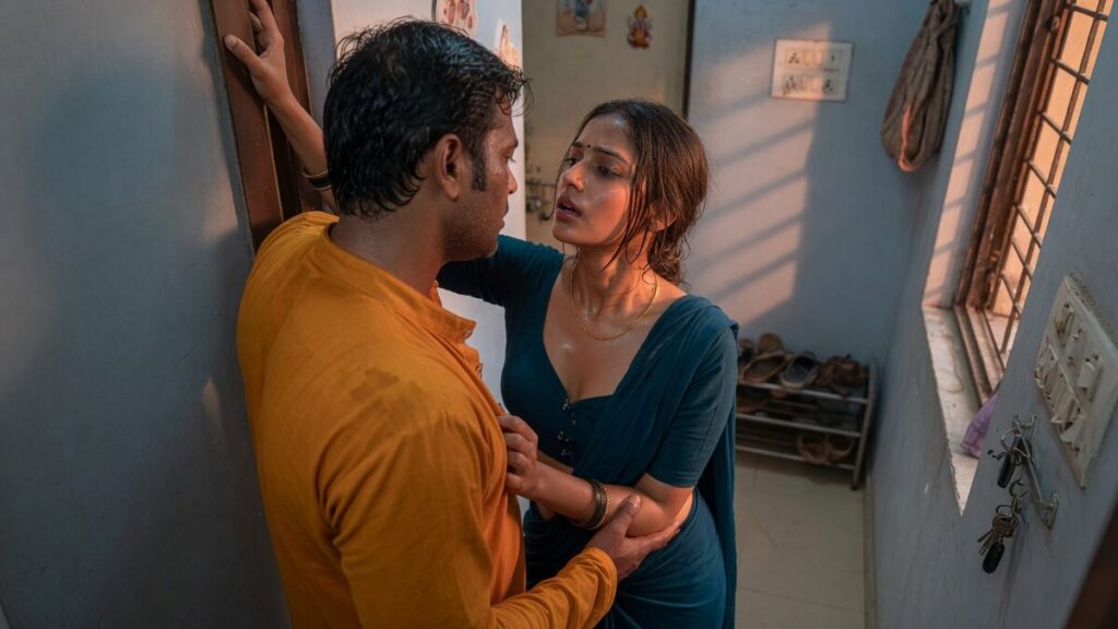 Two fully clothed adults, one adult Indian woman and one adult Indian man in a contemporary Indian city apartment entry.
