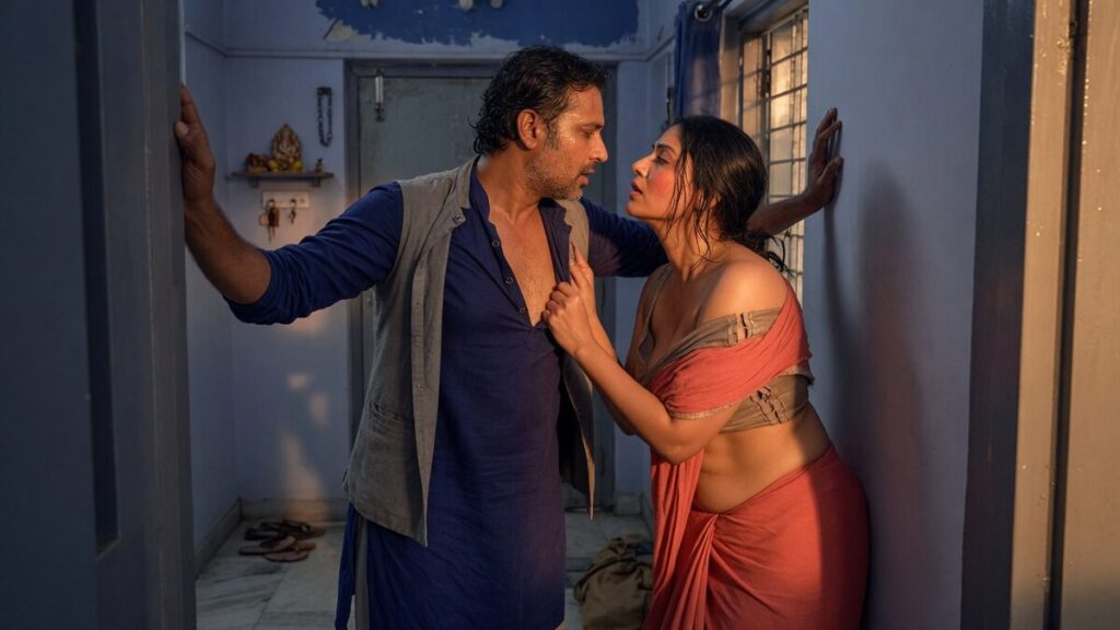 Two fully clothed adults, one adult Indian man and one adult Indian woman in a contemporary Indian city apartment entry.