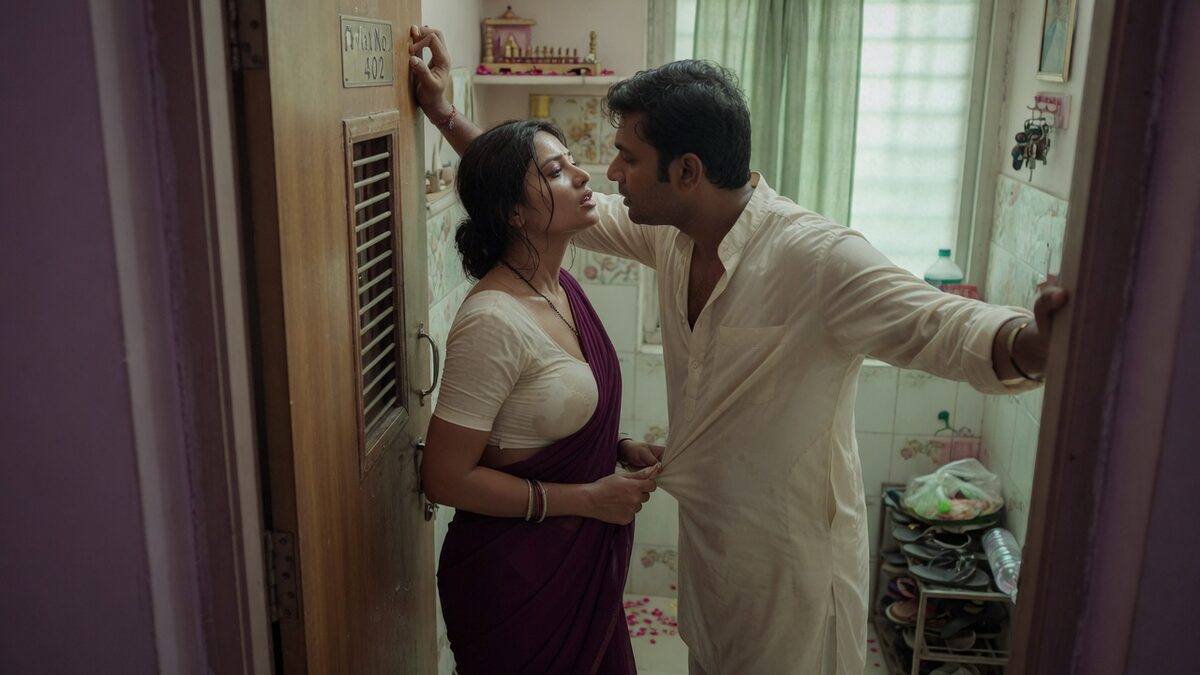 Two fully clothed adults, one adult Indian man and one adult Indian woman in an Indian apartment entry.